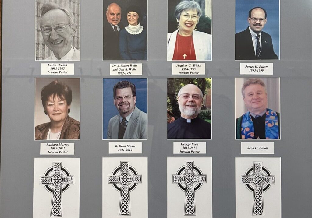 A framed picture of people with their faces in the middle.
