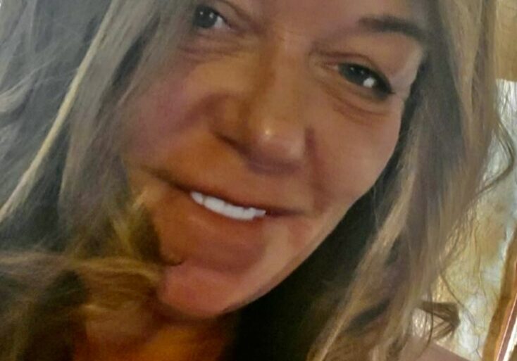 Close-up smiling woman with long hair
